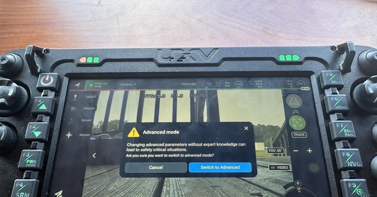 Auterion Mission Control's Advanced mode confirmation dialog, warning that changing advanced parameters without expert knowledge can lead to safety-critical situations, with Cancel and Switch to Advanced buttons